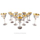 A set of twelve planished silver plated wine glasses