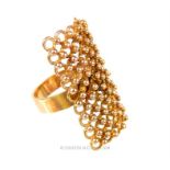 An 18 ct yellow gold, abstract, beaded panel ring