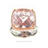 An 18 ct white gold, large faceted pink stone ring with diamonds