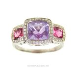 An 18 ct white gold, diamond, amethyst and pink sapphire ring