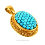An antique, high-carat, yellow gold and turquoise studded locket