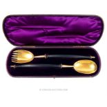 A pair of Victorian sterling silver gilt salad servers