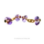 A pair of 18 ct yellow gold, amethyst cabochon, ruby and emerald cuff-links