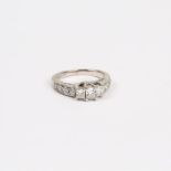 A 14 ct white gold, 3-stone, diamond ring (1.25 carats total)