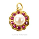 An 18 ct yellow gold flower pendant set with rubies and a cultured pearl