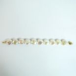 A boxed, 14 ct yellow gold, very large, cream, South Sea, coin-pearl bracelet