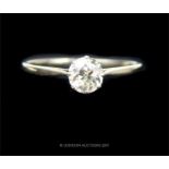 A 14 ct white gold and diamond solitaire ring (1/2 carat)