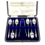 An Edwardian sterling silver set of apostle teaspoons and a matching pair of sugar tongs