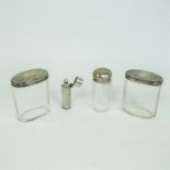 A late Victorian silver perfume bottle and three jars with silver lids