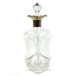 An Edwardian hourglass decanter with a sterling silver collar