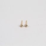 A boxed pair of 18 ct yellow gold and diamond solitaire stud earrings (0.20 carats)