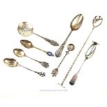 A collection of silver and silver plated spoons