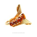 A 1940's, 14 ct yellow gold and orange garnet, cocktail ring