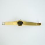 An 18 ct yellow gold, Omega wristwatch with diamond-set, black dial