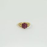 A 10 ct yellow gold and natural ruby, flower-head ring