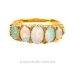 An 18 ct yellow gold, Victorian, graduated, five opal and diamond ring