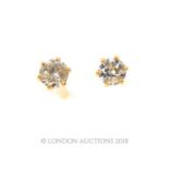 A boxed pair of 18 ct yellow gold, diamond solitaire stud earrings (0.10 carats total)