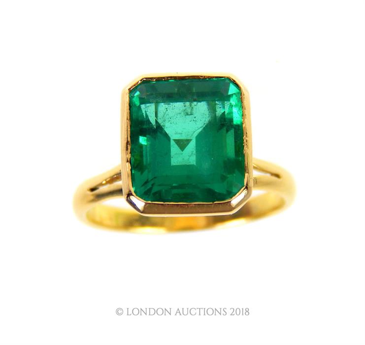 An 18 ct yellow gold, emerald ring (4.25 carats approx) with lab report