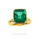 An 18 ct yellow gold, emerald ring (4.25 carats approx) with lab report