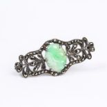 An Art Deco, silver, marcasite and carved green, jade brooch