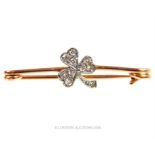 An antique, 9 ct rose gold and platinum, diamond-studded, shamrock pin brooch