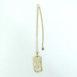 A 14 ct yellow gold and mother of pearl, finely carved, dragon, pendant on chain