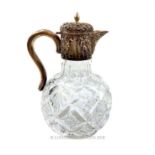 An Edwardian sterling silver and cut crystal claret jug