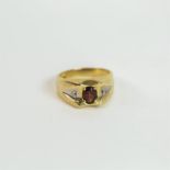 A 14 ct white and yellow gold, diamond and garnet ring