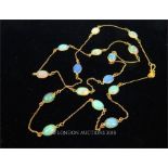 A 14 ct yellow gold necklace studded with fifteen, Ethiopian opals