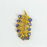 A high carat, yellow gold, antique brooch set with natural, Sri Lankan sapphires