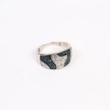 A contemporary, white metal, black and white diamond pave, ring