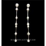 A pair of 18 ct white gold, diamond, drop earrings
