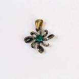 A white gold, old-cut diamond and emerald pendant