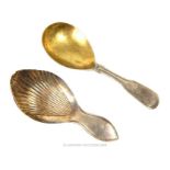 A George III Sterling Silver Fiddle Thread Pattern Caddy Spoon and a Sheffield Plated Example.
