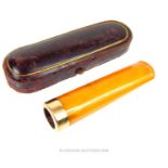 A 9ct yellow gold and amber cheroot holder