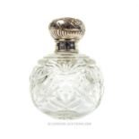 An Edwardian sterling silver and glass perfume bottle