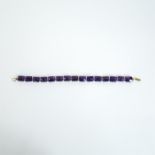 A boxed, 9 ct yellow gold and cushion-cut, faceted, amethyst bracelet