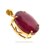 An 18 ct yellow gold, large, faceted, natural ruby pendant