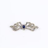 A boxed, Edwardian, diamond and sapphire, heart-shaped, bow brooch