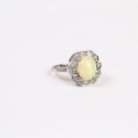 An 18 ct white gold, Art Deco style, opal and diamond cluster ring