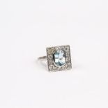 An 18 ct white gold, Art Deco style, aquamarine and diamond cluster ring