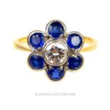 An 18 ct yellow gold, sapphire and diamond, flower-head ring