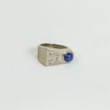 A 14 white gold, contemporary, star sapphire and diamond ring