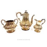 A mid Victorian silver plated three piece tea set.by Elkington & Co