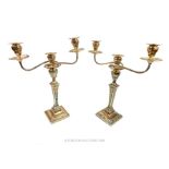 A pair of Edwardian Adam Revival sterling silver candelabra