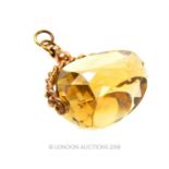 A 9 ct yellow gold and large, faceted citrine, fob pendant