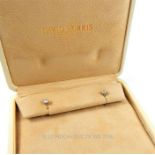 A boxed pair of 18 ct white gold and diamond, solitaire studs (Total 0.60 carats)