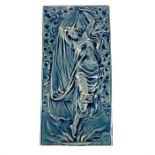 An early 20th century blue glazed tile, decorated with a diaphanous robed maiden dancing; 31cm x