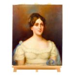 An unframed early 19th century oil on canvas portrait of a lady