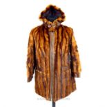A ladies, striped, brown mink fur and leather coat